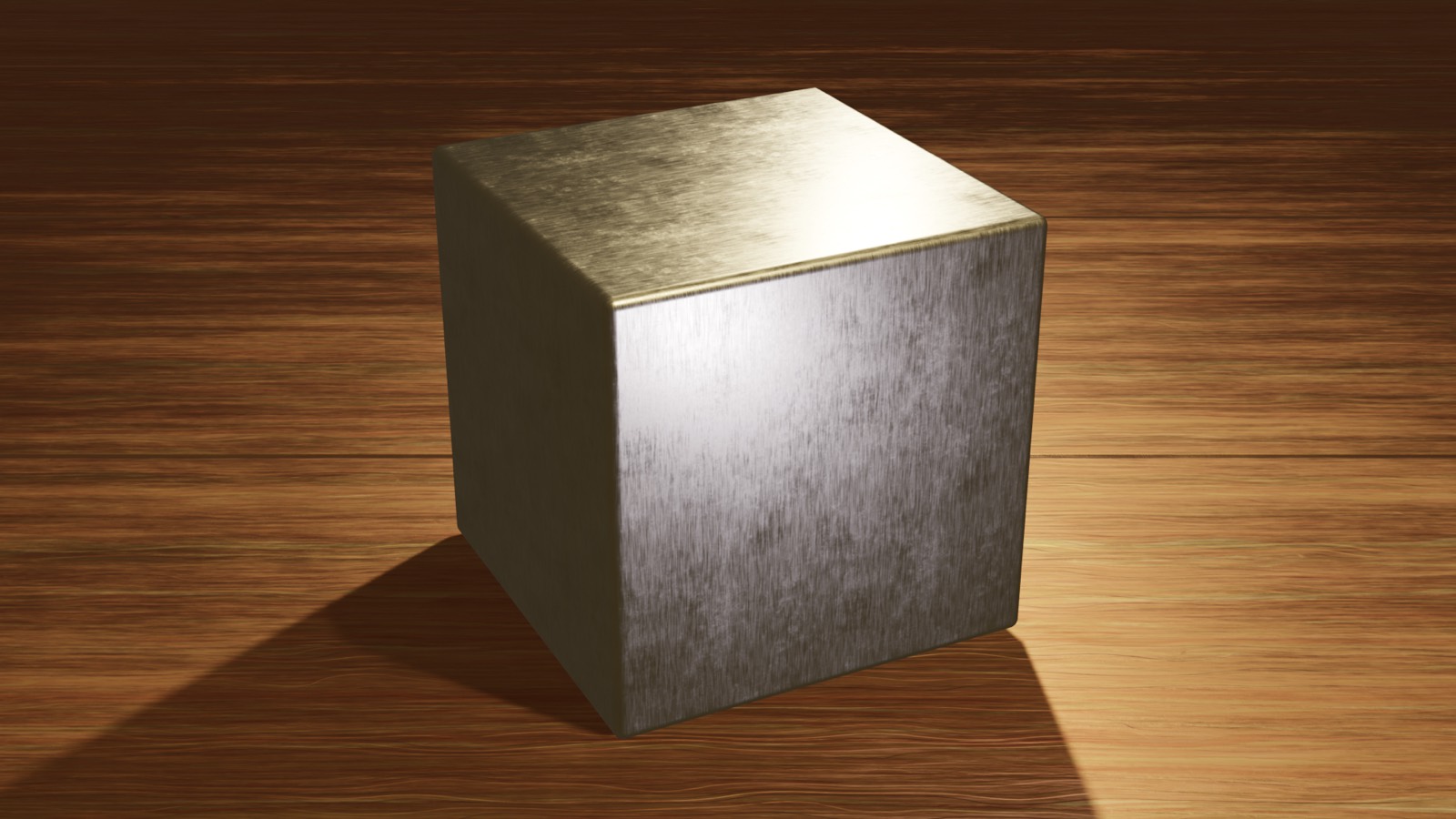 Un cube métallique posé sur une table en bois, vu en perspective